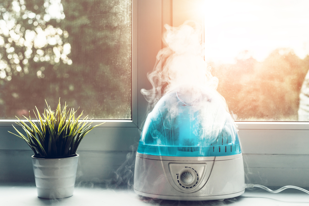 A humidifier running inside a home. Discover what is the ideal humidity level in a home.